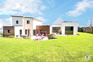 Enjoy a home away from home with a spacious backyard and patio area, perfect for relaxing and taking in the surroundings.