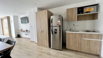 Fridge, microwave, stovetop, coffee/tea maker
