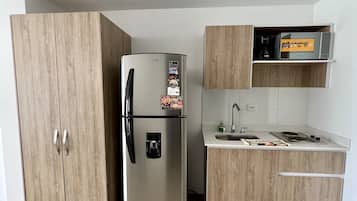 Fridge, microwave, stovetop, coffee/tea maker