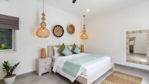 A modern bedroom with a bed, bedside tables, decorative wall art, and a large mirror. - Beautiful 3BR Villa W/ Private Pool in Bali, Bali Villa 2207 (Bali)