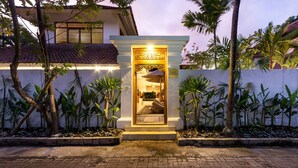 A villa entrance with a decorative archway, a small porch, and a sign reading "Villa Leisabella". - Wonderful 4BR Villa with Pool, Bali Villa 2212 (Bali)