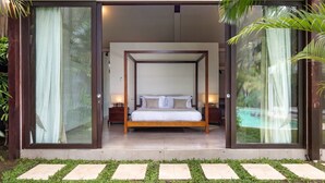 A bedroom with a four-poster bed, a nightstand, and a lamp. - Cozy 2BR Villa W/Amazing Pool Area, Bali Villa 2216 (Bali)