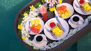 A breakfast tray with plates of food, drinks, and a basket of flowers. - Spacious 4BR Villa W/ Pool & Garden, Bali Villa 2233 (Bali)