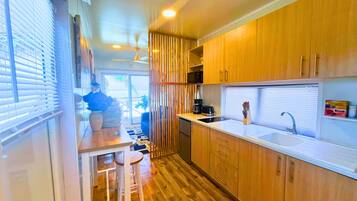 Fridge, microwave, stovetop, coffee/tea maker