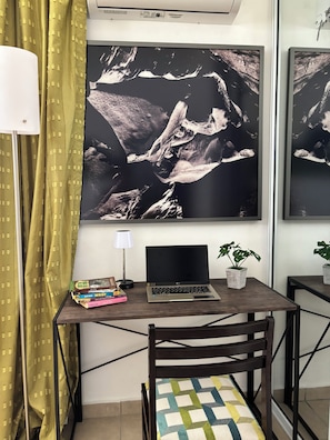 Work in comfort with a desk, chair, and ample space for productivity.