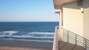A balcony with a view of the ocean.