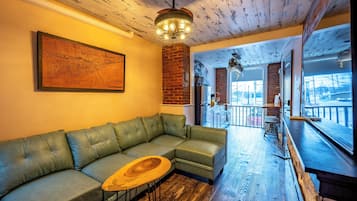 Loft, 1 Bedroom, City View | Living area | 50-inch Smart TV with digital channels, fireplace, Netflix