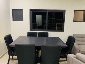 Enjoy meals with friends and family at the dining table surrounded by six comfortable chairs.