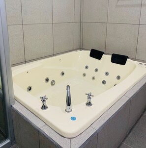 Jetted bath, hair dryer, towels, soap