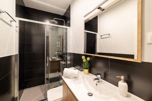 Shower, hair dryer, towels, soap