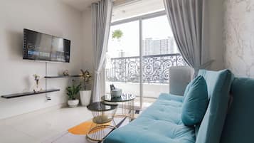 Family Apartment | Living area | 55-inch Smart TV with satellite channels, TV