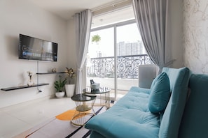 Family Apartment | Living area | 55-inch Smart TV with satellite channels, TV