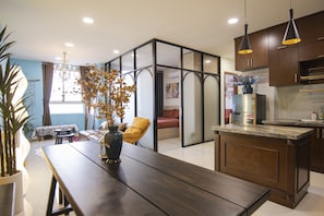 Family Apartment, 4 Bedrooms, Pool Access, City View | Living area | 55-inch Smart TV with satellite channels, TV