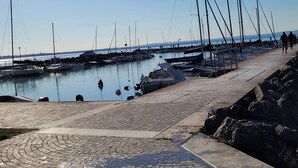 A marina with boats docked, a paved walkway, and a clear sky. - Villa 'My Lagozise' with Private Pool, Wi-Fi and Air Conditioning (Pacengo)