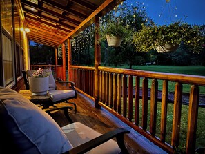 A wooden deck with a railing, a bench, and potted plants. - Mossy at Forest Villas: Private Axe Pit, Swing Fire Pit & Pergola Retreat (Marienville)