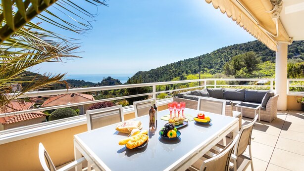 A terrace with a table set for breakfast, overlooking a scenic landscape. - EZE VISTA AP4328 By Riviera Holiday Homes (Eze)