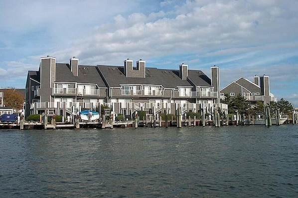 A waterfront property with multiple buildings, docks, and boats.