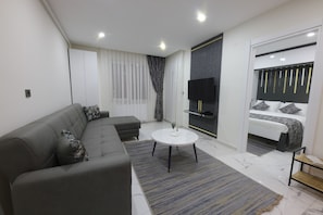 Suite estudio Deluxe, para fumadores, vista a la ciudad | 1 habitación, sábanas de algodón egipcio y ropa de cama de alta calidad
