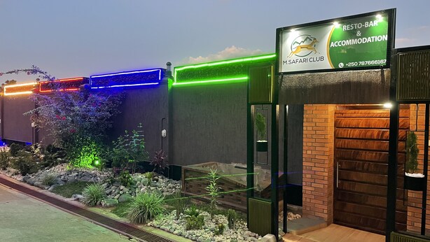 A building with a sign for M. Safari Club, indicating a restaurant and accommodation. - M Safari Club (Kigali)