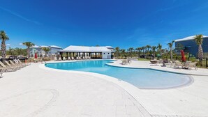 A swimming pool with lounge chairs and a covered seating area. - *SPECIAL* Summer Salt 38*NEW* SLEEPS 19 4 bed 4.5 bath home Orange Beach (Orange Beach)