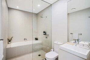 Bathtub, hair dryer, towels