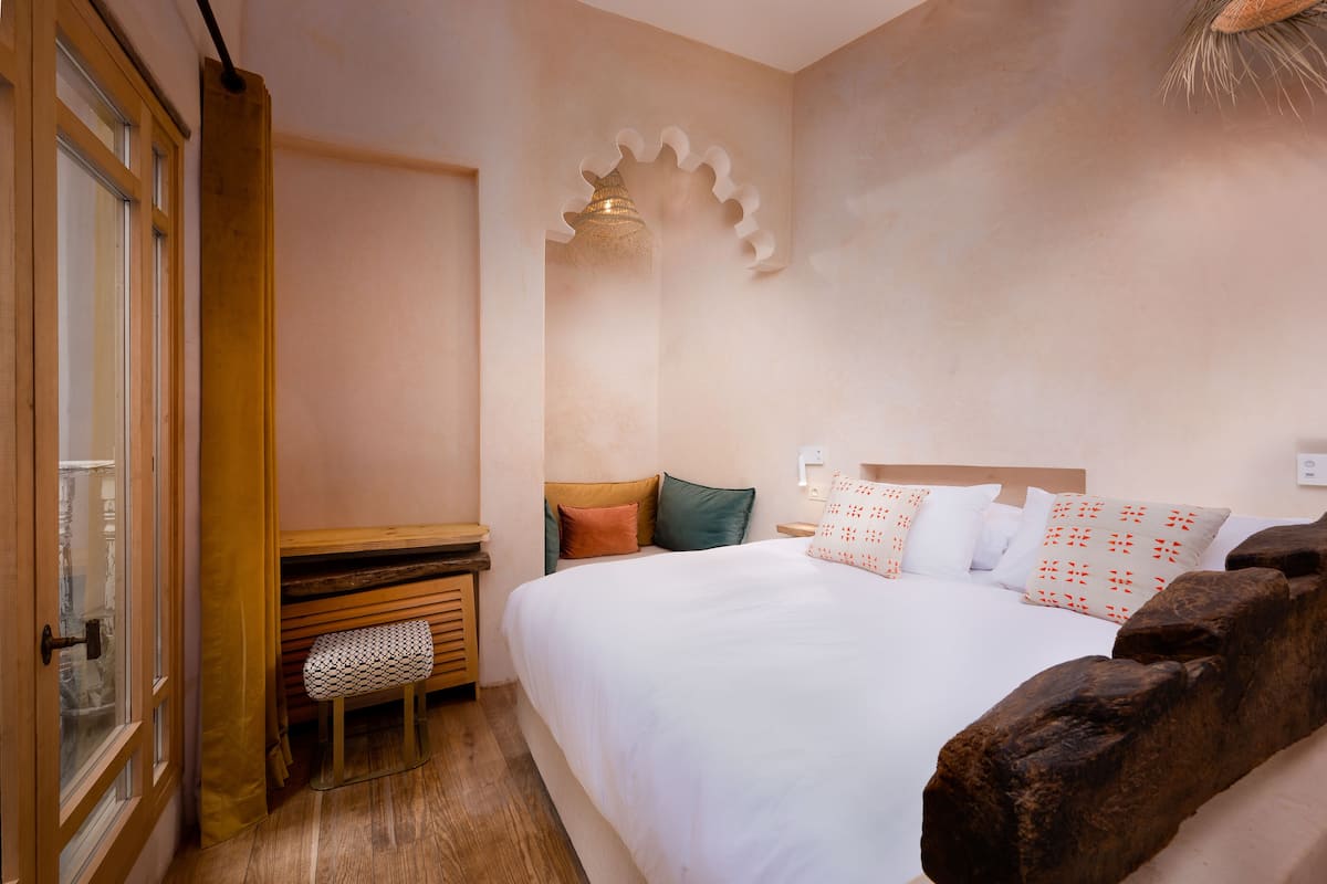 Premium Duplex | 2 bedrooms, in-room safe, individually decorated, blackout drapes