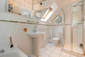 Bathtub, hair dryer, towels, soap