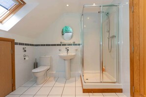 Bathtub, hair dryer, towels, soap