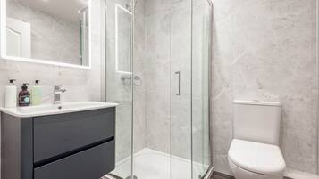 Shower, hair dryer, towels, soap