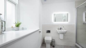 Shower, hair dryer, towels, soap