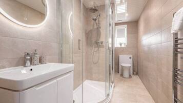 Shower, hair dryer, towels, soap