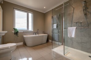 Bathtub, hair dryer, towels, soap