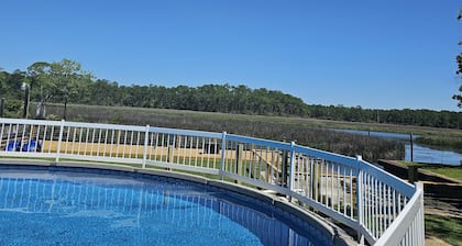 HotTub/Fish/RIVER FRONT/DOGS/SUMMER POOL.RIGHT BY GULF AND BEACHES. BRING BOAT!