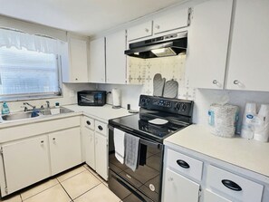Fridge, microwave, cookware/dishes/utensils