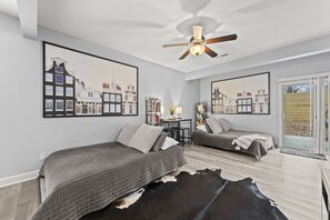 Here’s the flexibility we promised. These two queen-size futons give your group additional sleeping space right on the main level—no stairs required. It’s an easy option for guests who prefer to stay downstairs, and by morning, everyone can be right back  - Home Away from Home Close to KCI Airport, Weston (Platte City)