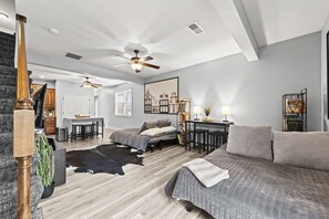 Now you can see why the main level works so well for a group. Two queen-size futons provide additional sleeping space, with the full bathroom and steam shower on the same level—so guests can sleep and shower without using the stairs. By day, it all opens  - Home Away from Home Close to KCI Airport, Weston (Platte City)