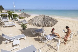 Private beach, white sand, sun loungers, beach bar