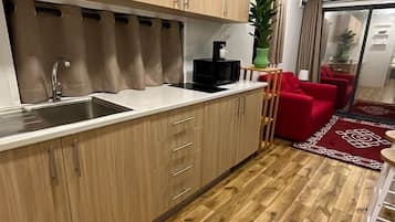 Fridge, microwave, stovetop, coffee/tea maker