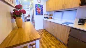 Fridge, microwave, stovetop, coffee/tea maker