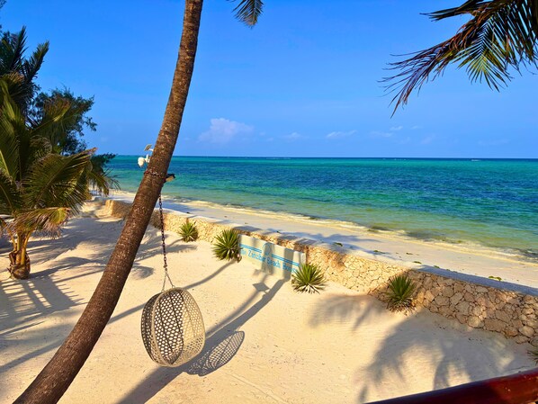 On the beach, sun-loungers, beach towels