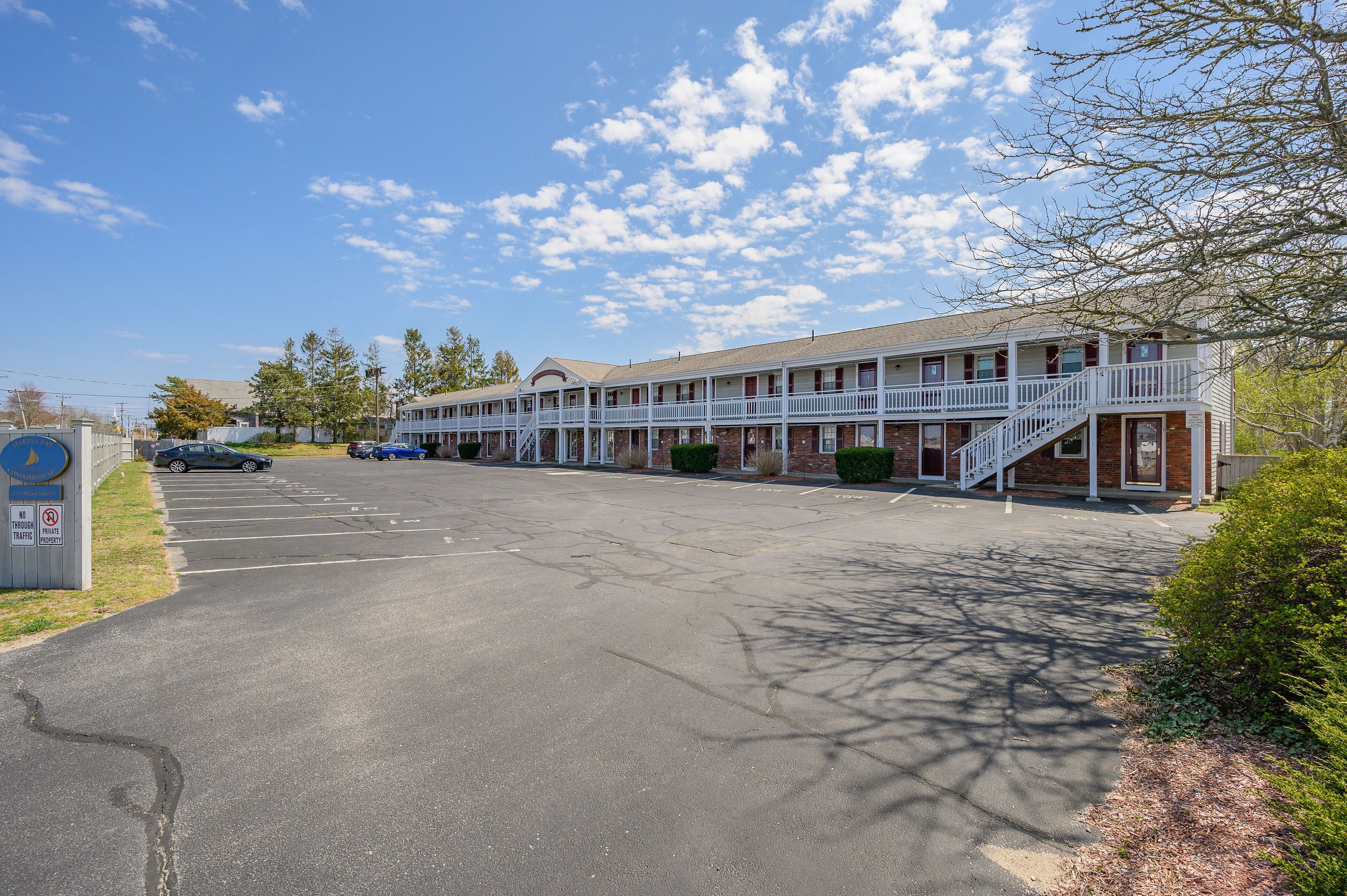 A motel with a central corridor and individual rooms on either side.