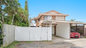 A two-story house with a garage and a covered driveway. - Oasis Lennox Head unit (Lennox Head)