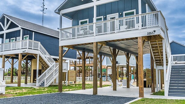 A beachfront building with a covered deck and multiple levels. - Steps to Beach & Community Pool! (Bolivar Peninsula)