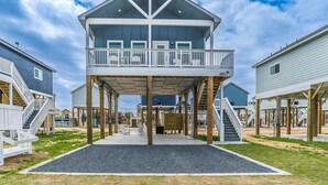 A two-story beach house with a balcony, wooden deck, and multiple staircases. - Steps to Beach & Community Pool! (Bolivar Peninsula)