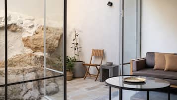 Deluxe Suite, 2 Bedrooms, Patio | Living area | 50-inch Smart TV with digital channels, TV, streaming services