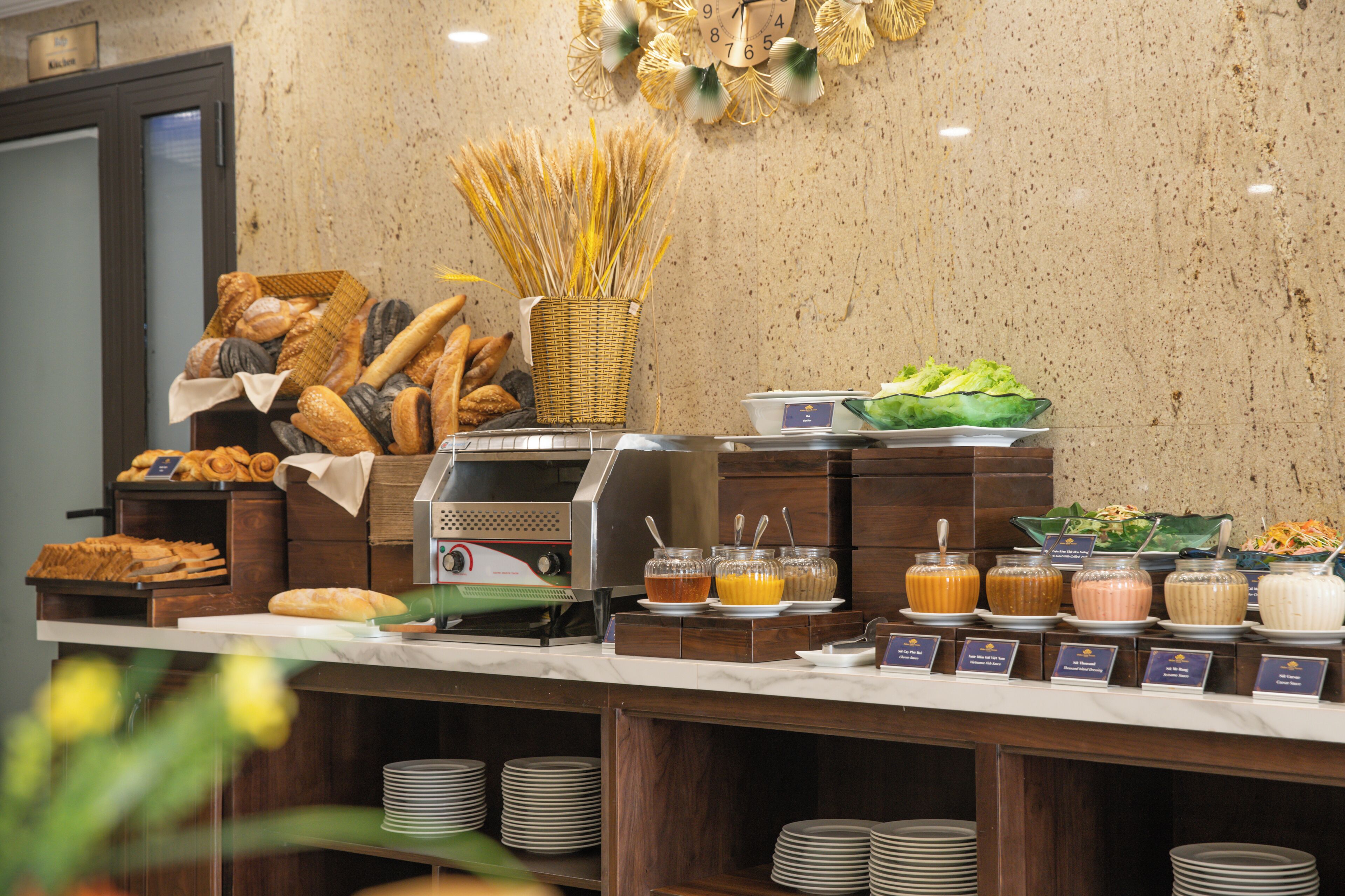 A buffet counter with various food items and beverages.