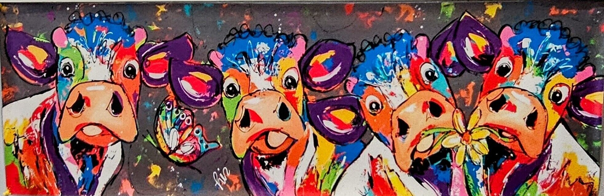 A colorful abstract painting with multiple faces and vibrant splashes of paint.