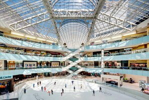 Shop and dine at this vibrant shopping mall featuring a spacious central atrium and a variety of retail stores.
