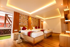 A modern hotel room with two beds, wooden flooring, a large window, and a decorative wall. - Hotel Elegant Kathmandu Inn (Kathmandu)