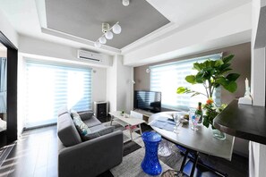 デラックス ルーム | リビング エリア | 液晶テレビ